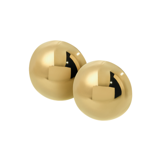 Pair of gold spherical earrings on a white background